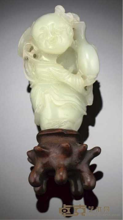 19th/20th century A greenish white jade carving of a standing boy 